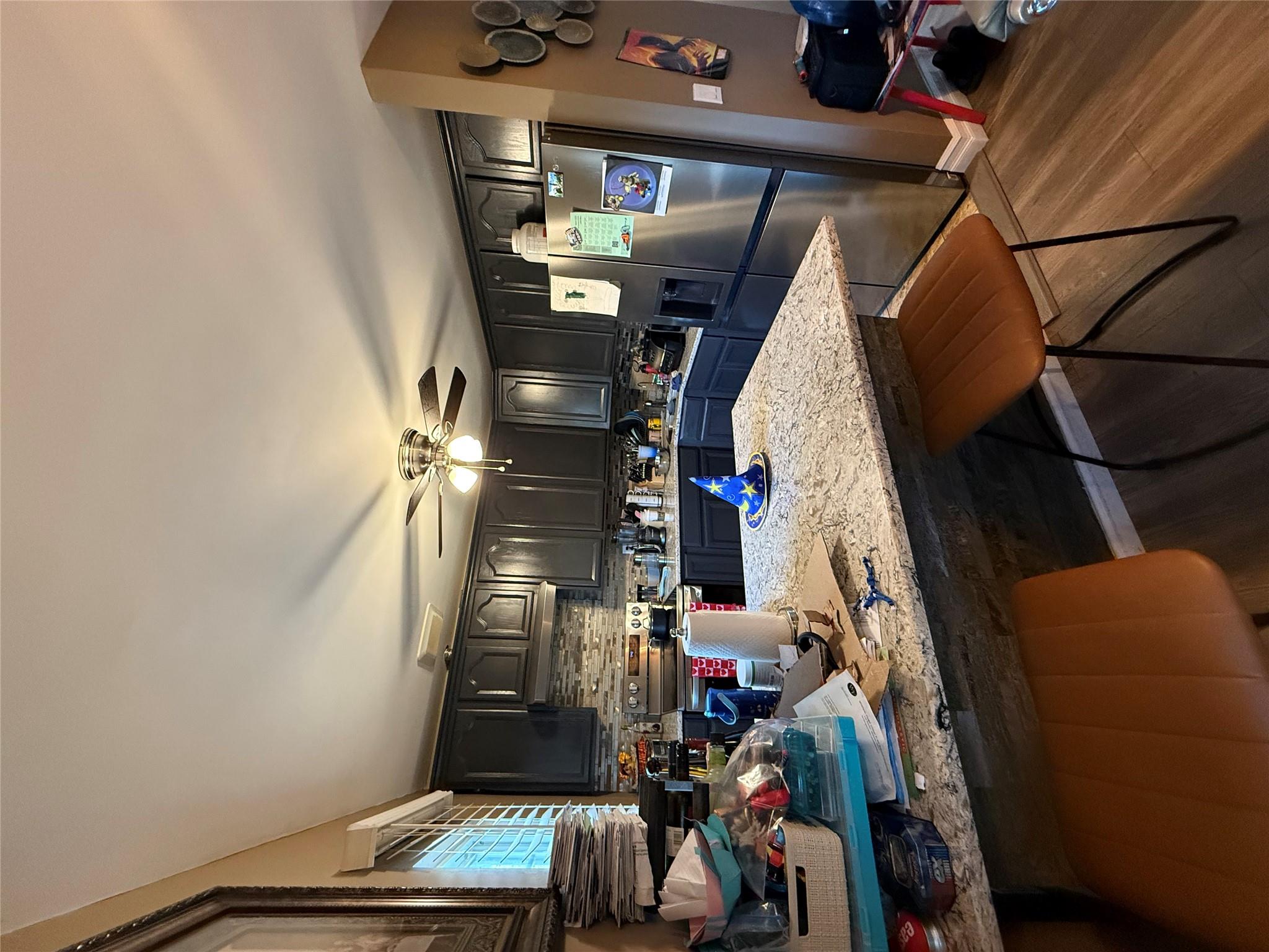 17 Hampton Road Shirley, NY 11967 - Photo 7 of 26 Kitchen with refrigerator, decorative backsplash, light wood-style floors, range, and a peninsula