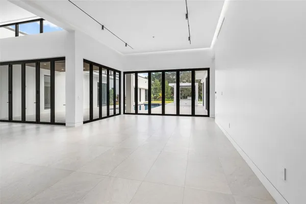 a kitchen with a sink a counter top space and stainless steel appliances