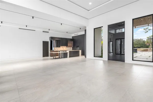 a large kitchen with a table and chairs