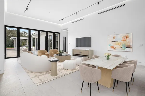 a view of an empty room with glass door
