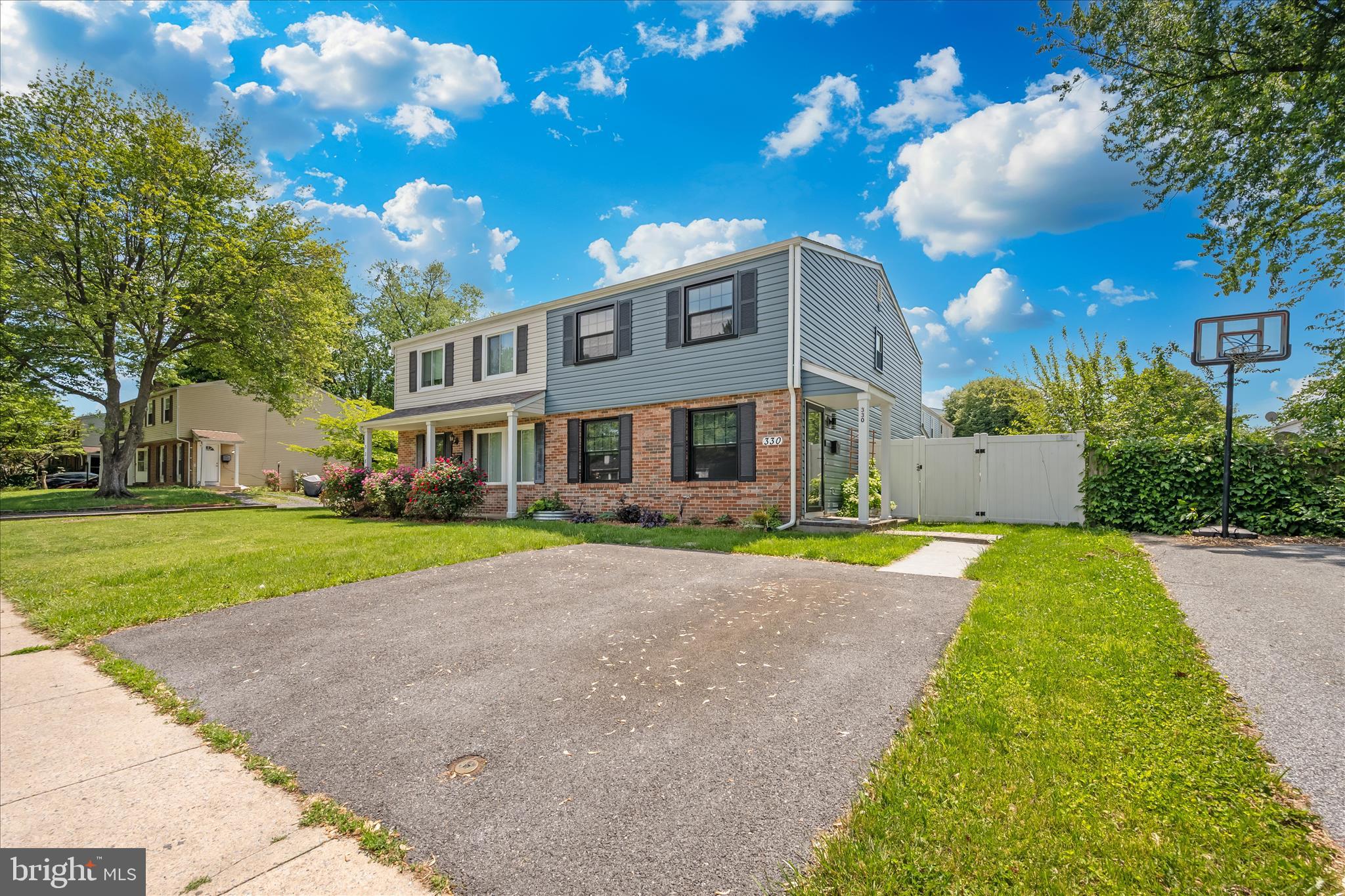 330 Heather Ridge Drive Frederick, MD 21702 - Photo 25 of 39 a front view of a house with a yard and garage