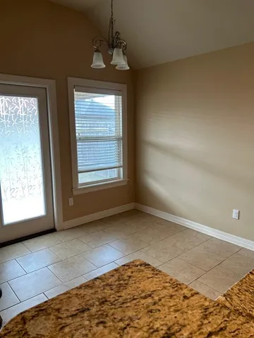 a view of an empty room and window