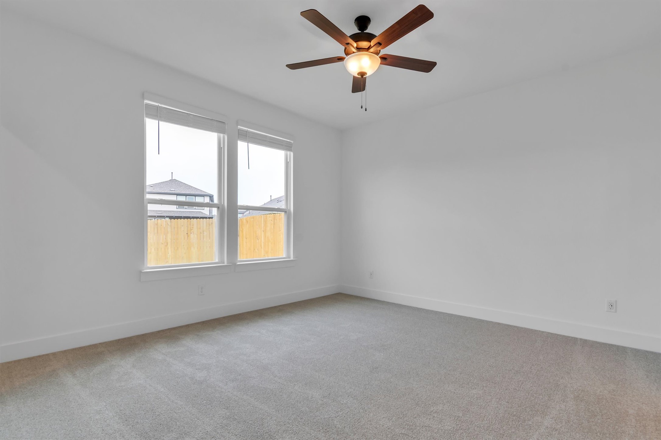 368 Bridge Deck Loop Kyle, TX 78640 - Photo 25 of 40 Unfurnished room with carpet floors, baseboards, and ceiling fan