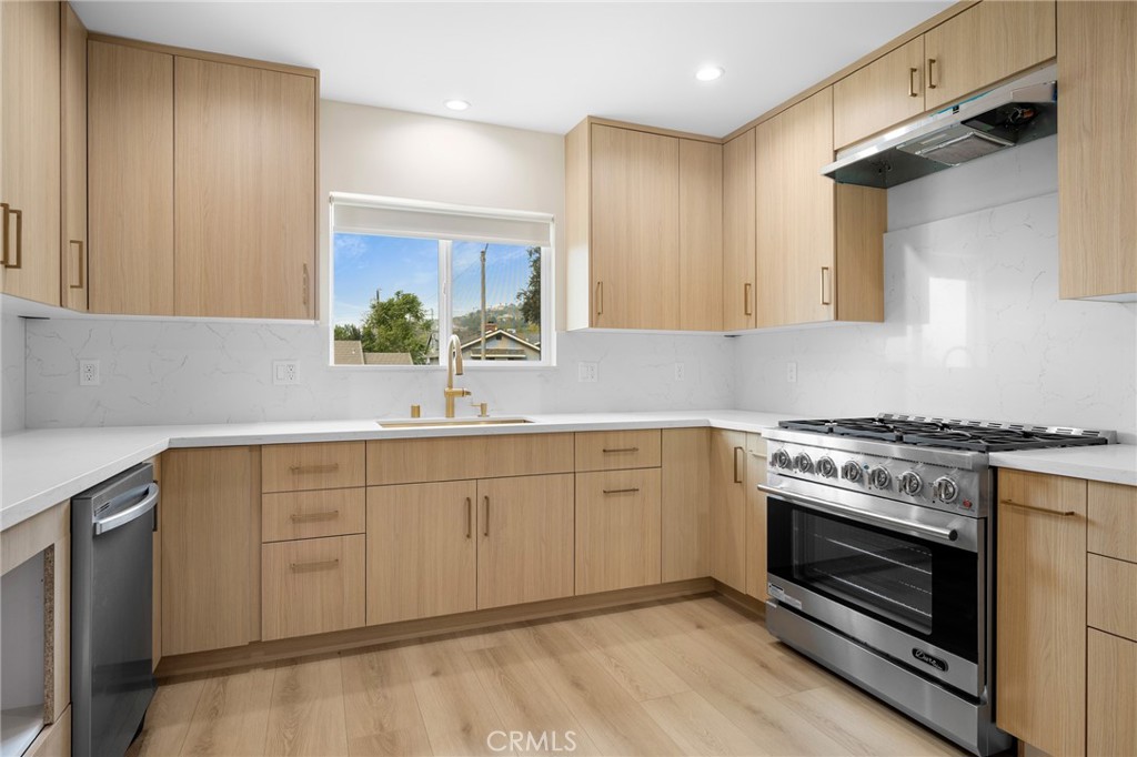 918 University Burbank, CA 91504 - Photo 12 of 30 a kitchen with granite countertop cabinets stainless steel appliances and a potted plant