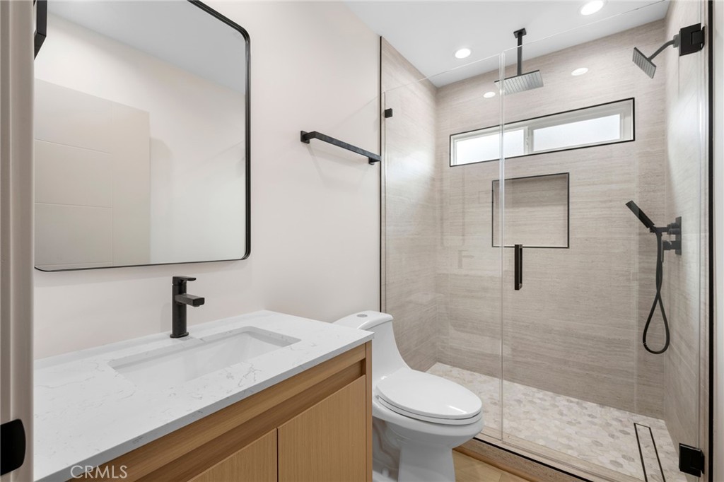 918 University Burbank, CA 91504 - Photo 25 of 30 a bathroom with a sink a toilet and a shower