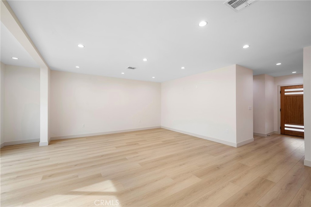 918 University Burbank, CA 91504 - Photo 6 of 30 a view of an empty room with wooden floor and windows