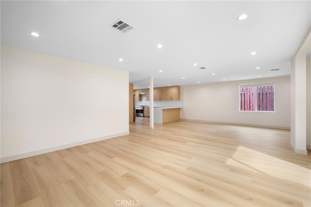 918 University Burbank, CA 91504 - Photo 7 of 30 a view of empty room with wooden floor and window