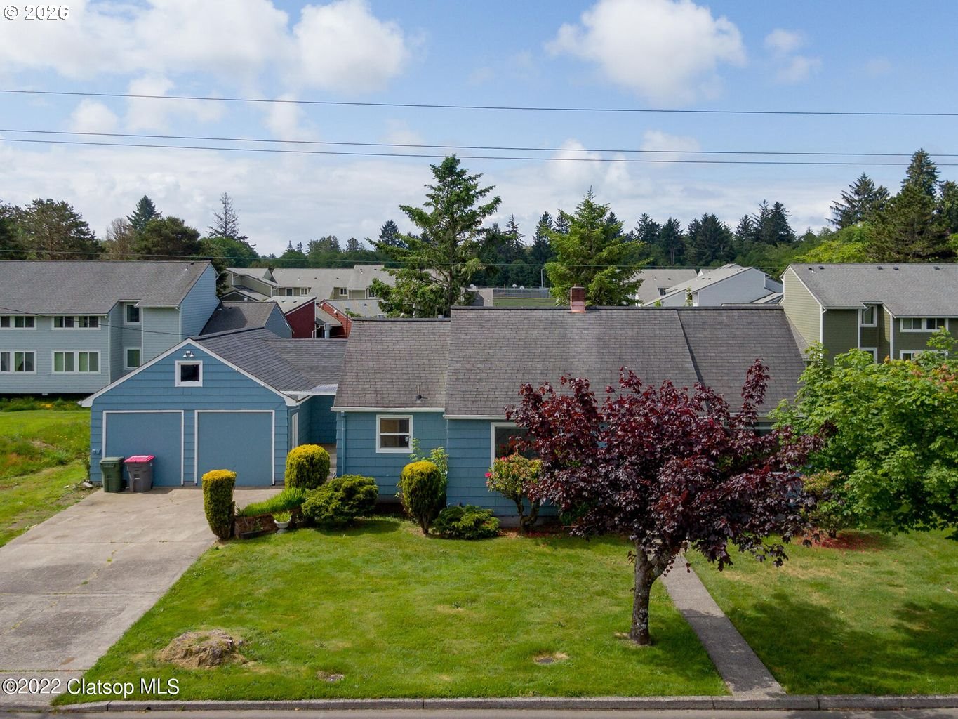 135 Southwest 2nd Street Warrenton, OR 97146 - Photo 1 of 46 a view of a house with a garden