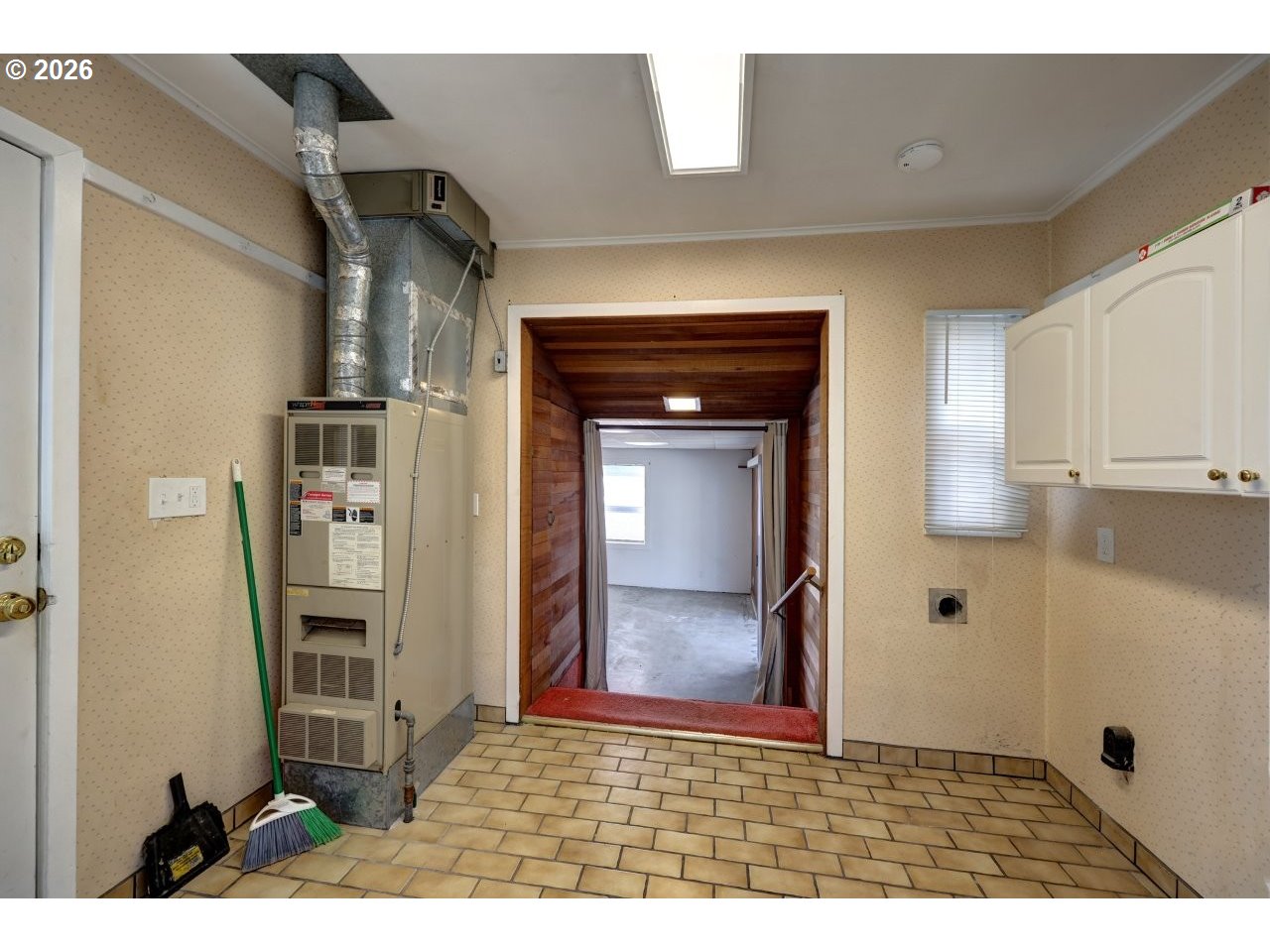 135 Southwest 2nd Street Warrenton, OR 97146 - Photo 19 of 46 a view of a hallway with wooden floor and windows
