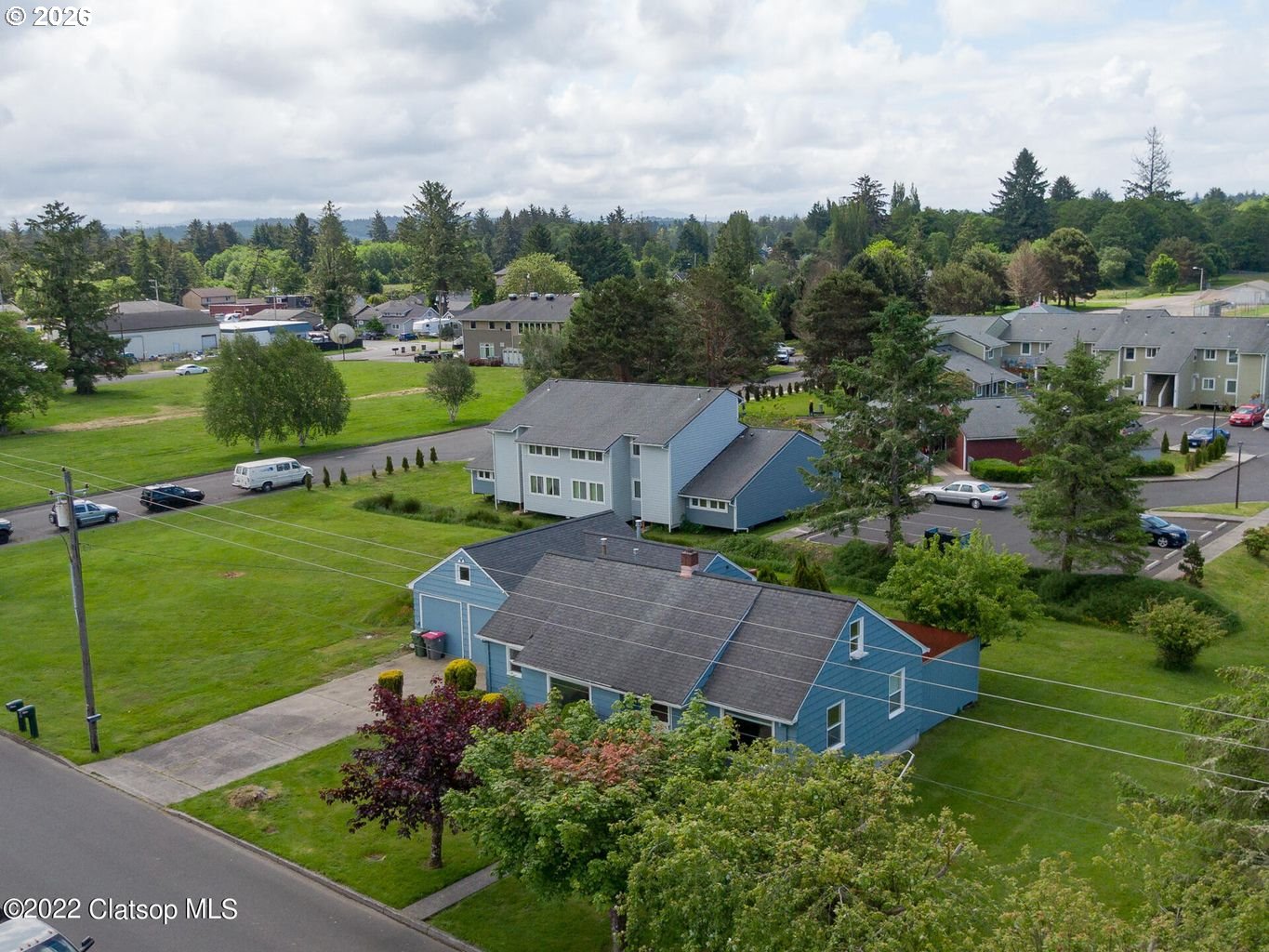 135 Southwest 2nd Street Warrenton, OR 97146 - Photo 2 of 46 an aerial view of a house with garden space lake view and houses with outdoor space