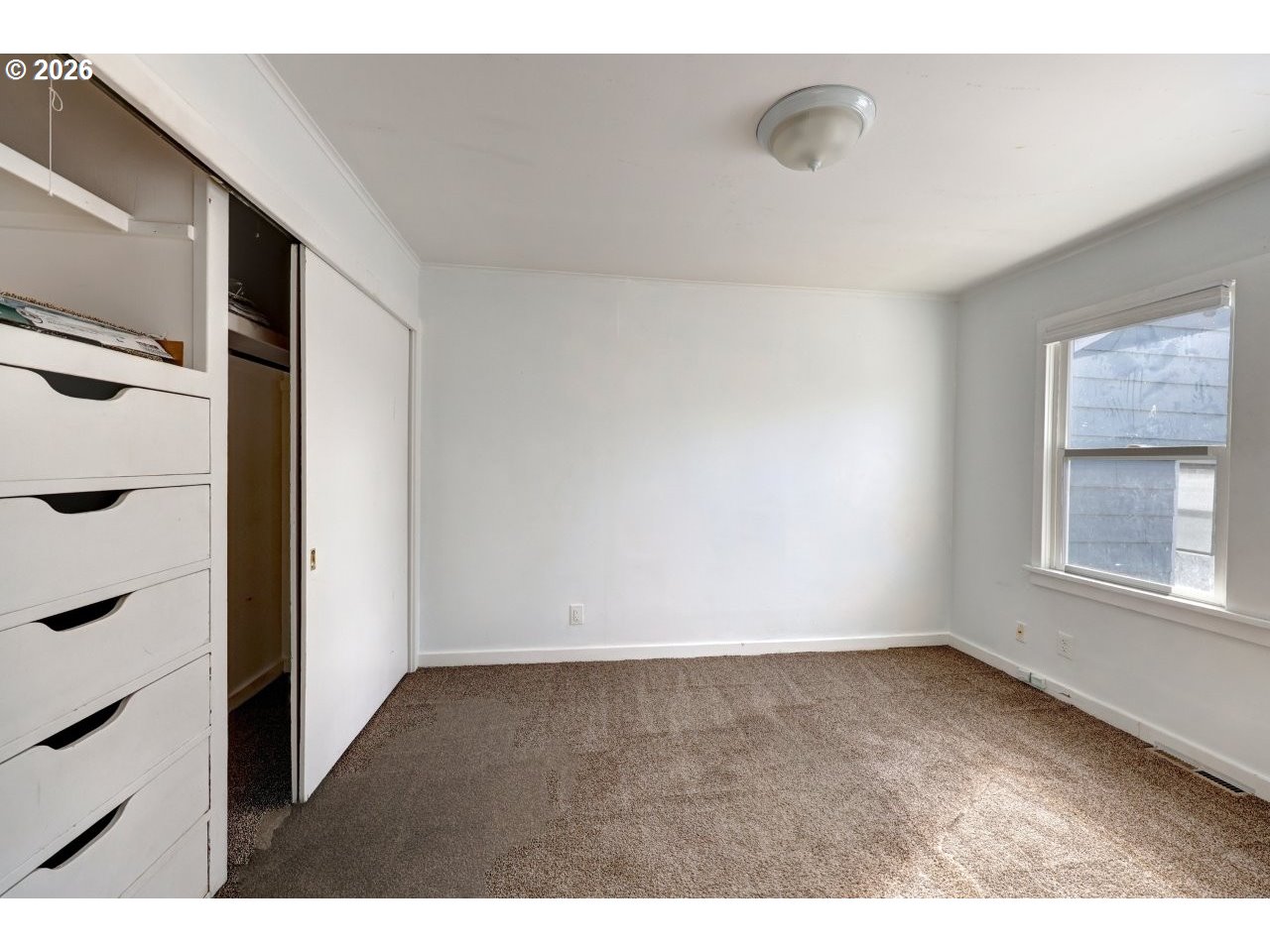 135 Southwest 2nd Street Warrenton, OR 97146 - Photo 27 of 46 a view of an empty room with a window