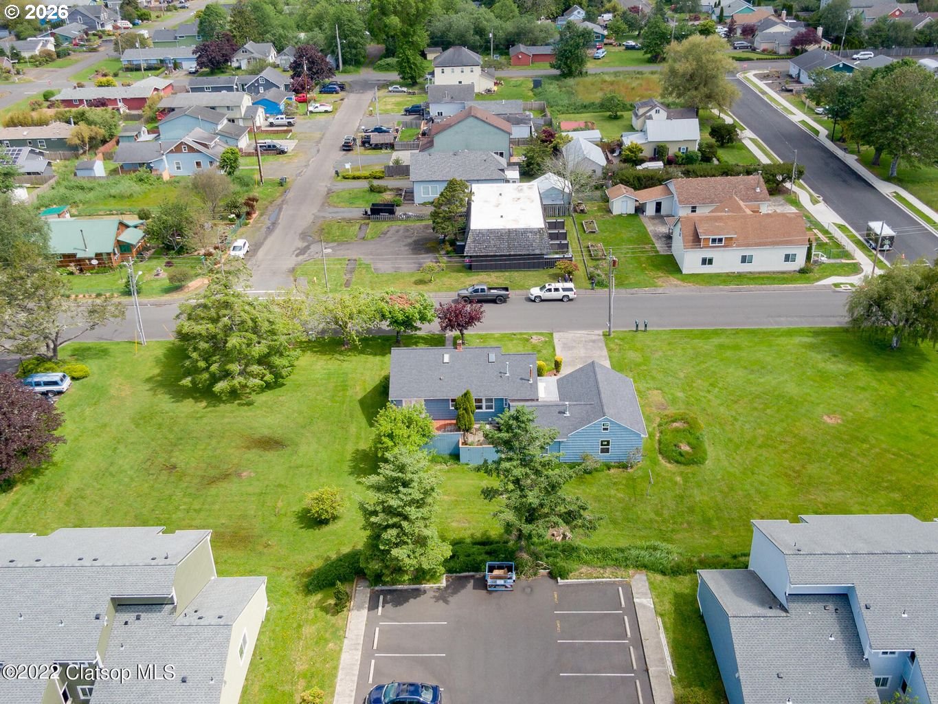 135 Southwest 2nd Street Warrenton, OR 97146 - Photo 3 of 46 an aerial view of a house with a yard basket ball court and outdoor seating