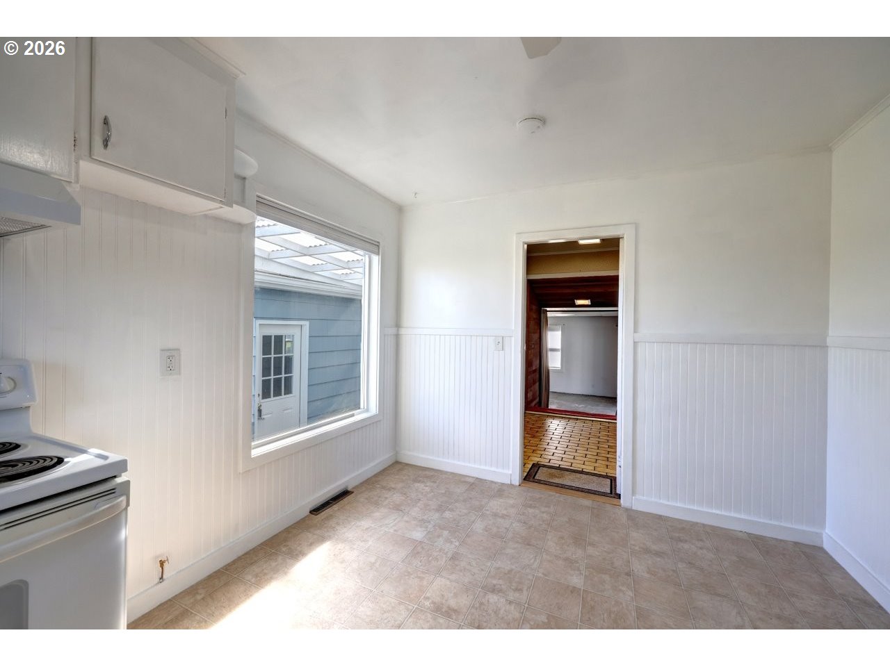 135 Southwest 2nd Street Warrenton, OR 97146 - Photo 41 of 46 a view of an empty room with a kitchen and a window