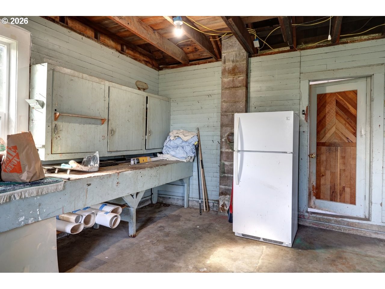 135 Southwest 2nd Street Warrenton, OR 97146 - Photo 45 of 46 a room with furniture and a wooden floor