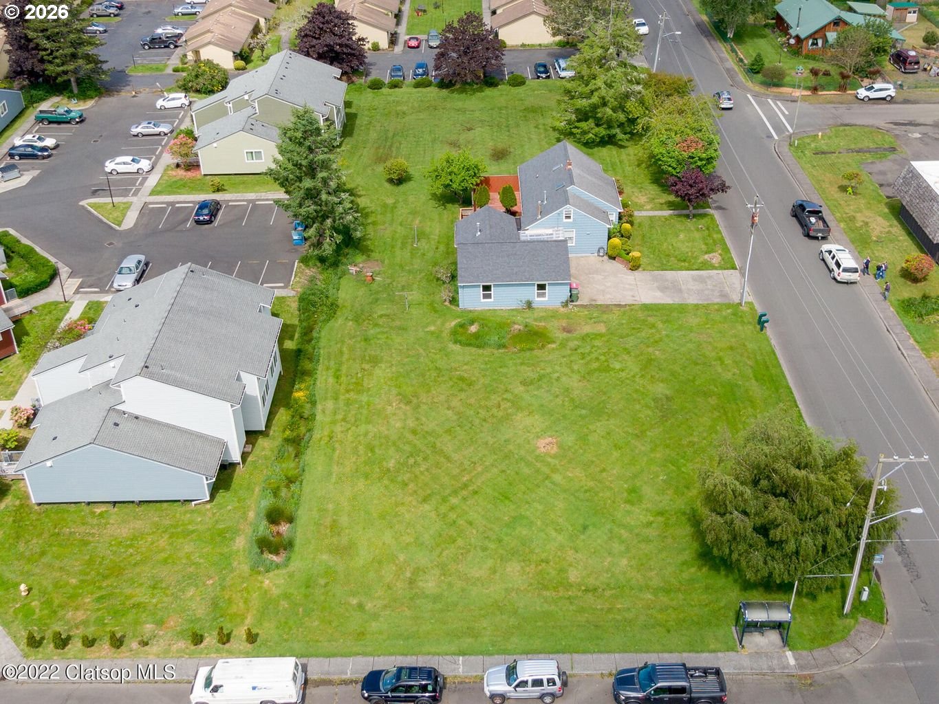 135 Southwest 2nd Street Warrenton, OR 97146 - Photo 5 of 46 an aerial view of a house with a yard
