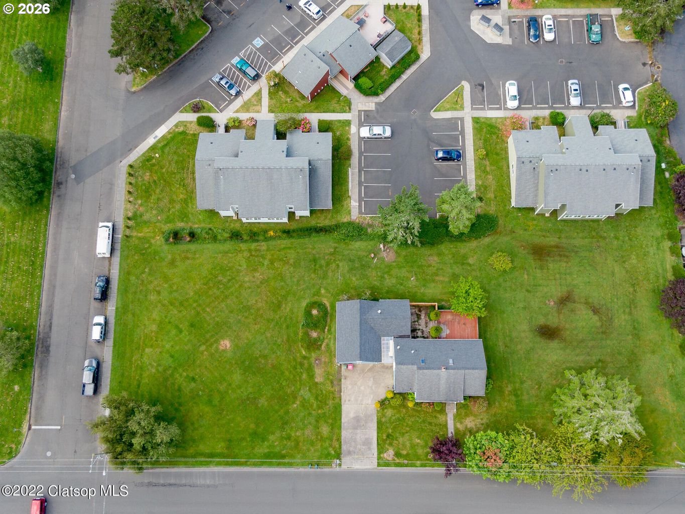 135 Southwest 2nd Street Warrenton, OR 97146 - Photo 8 of 46 an aerial view of a house with a garden