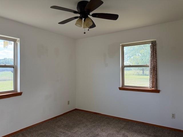 1643 North 4100th Road Soper, OK 74759 - Photo 17 of 30 an empty room with a window and a fan