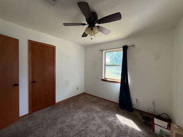 1643 North 4100th Road Soper, OK 74759 - Photo 18 of 30 a view of an empty room and window ceiling fan