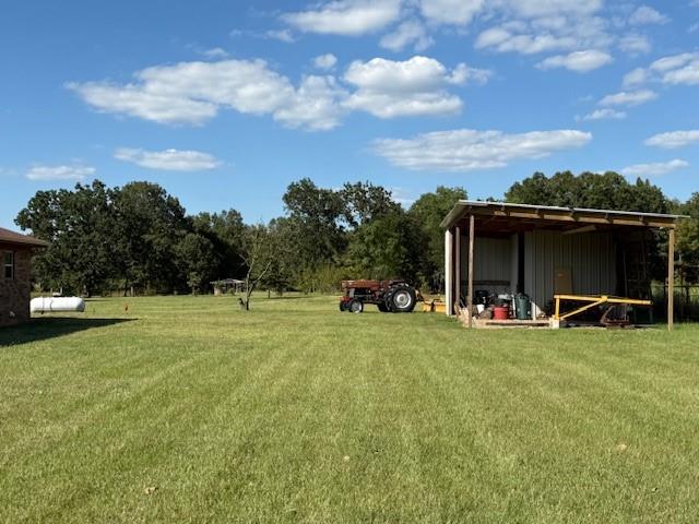 1643 North 4100th Road Soper, OK 74759 - Photo 25 of 30 a view of a house with backyard and porch