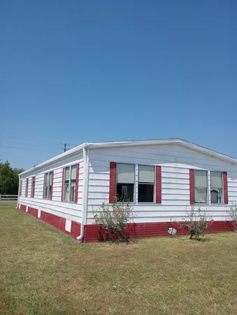 a front view of the house with yard