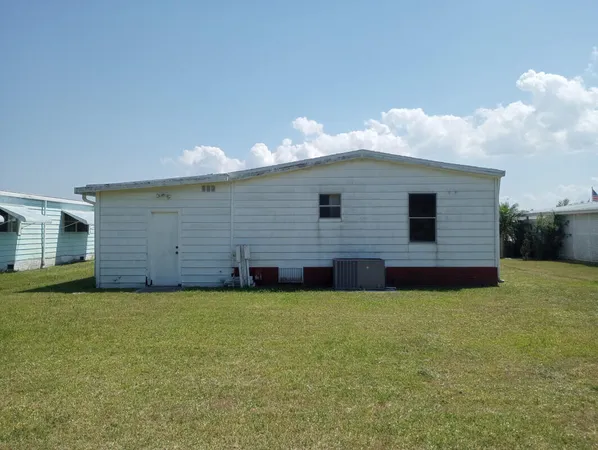 a view of a backyard of the house