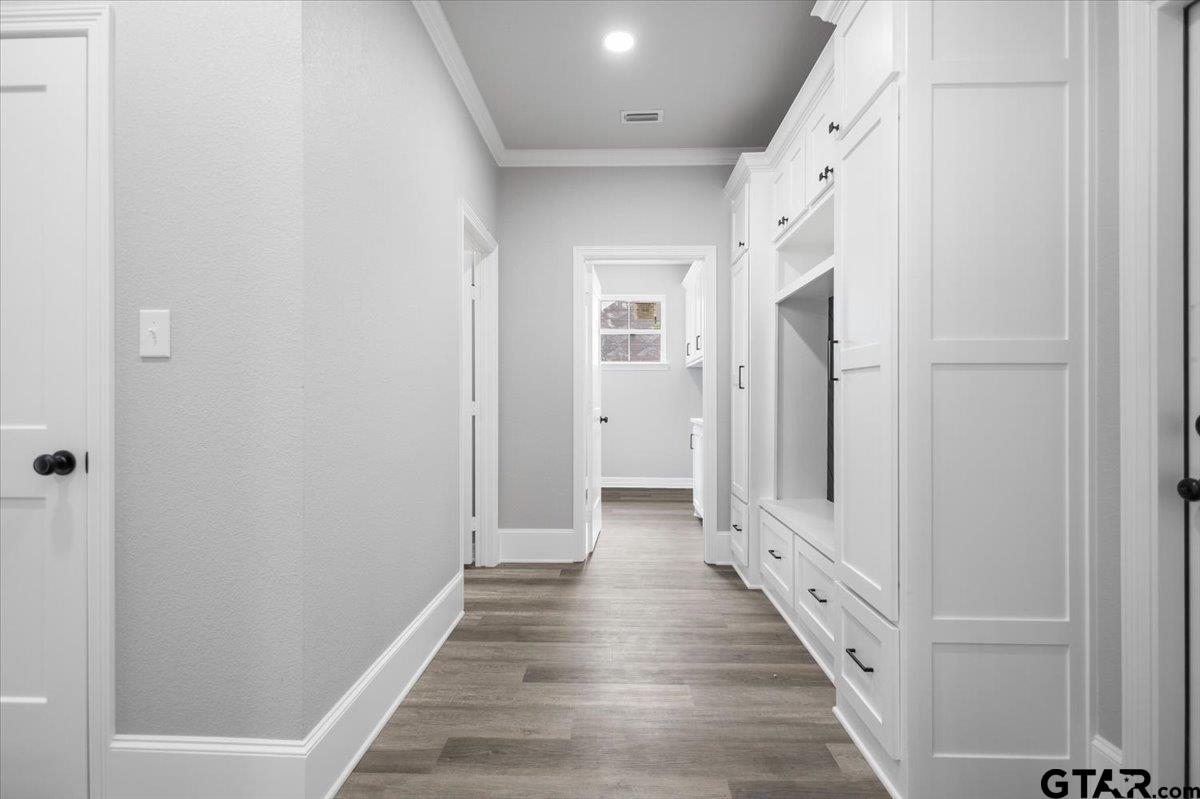 19462 Cedarpark Place Lindale, TX 75771 - Photo 20 of 48 a view of a hallway with wooden floor and staircase