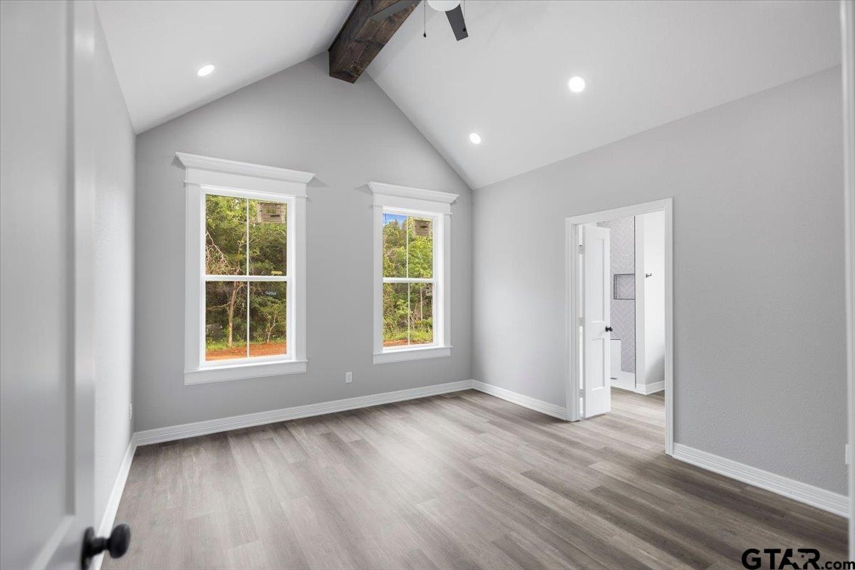 19462 Cedarpark Place Lindale, TX 75771 - Photo 23 of 48 an empty room with wooden floor and windows