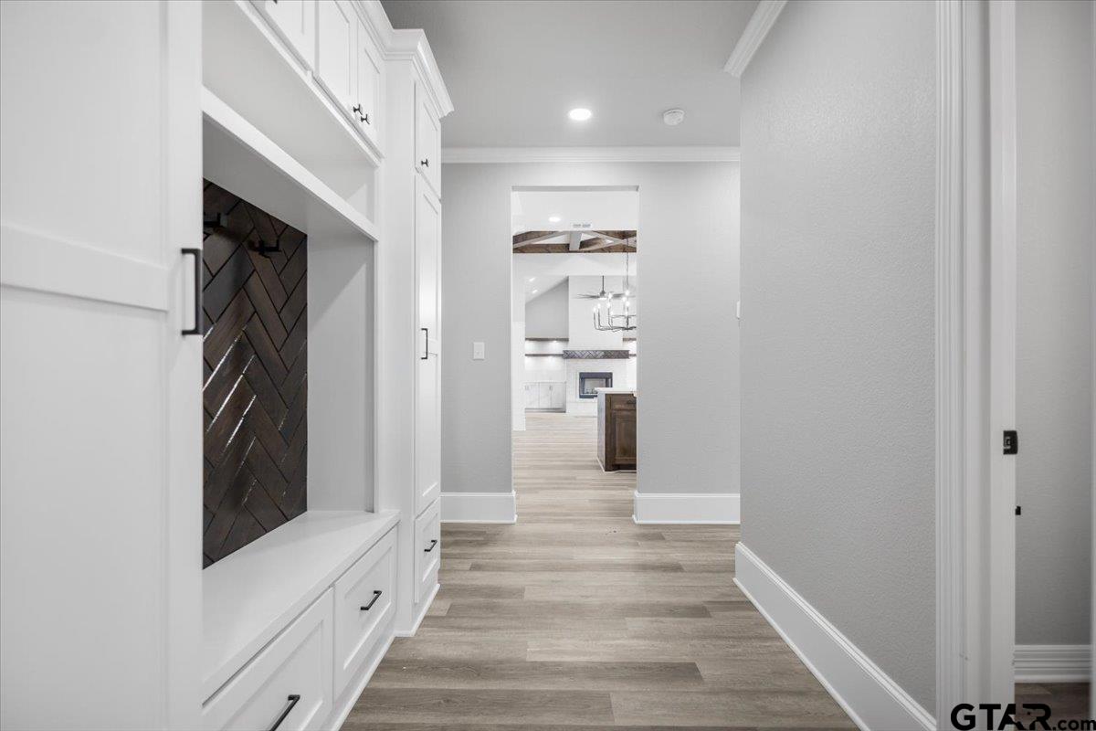 19462 Cedarpark Place Lindale, TX 75771 - Photo 26 of 48 a view of a hallway with wooden floor and staircase