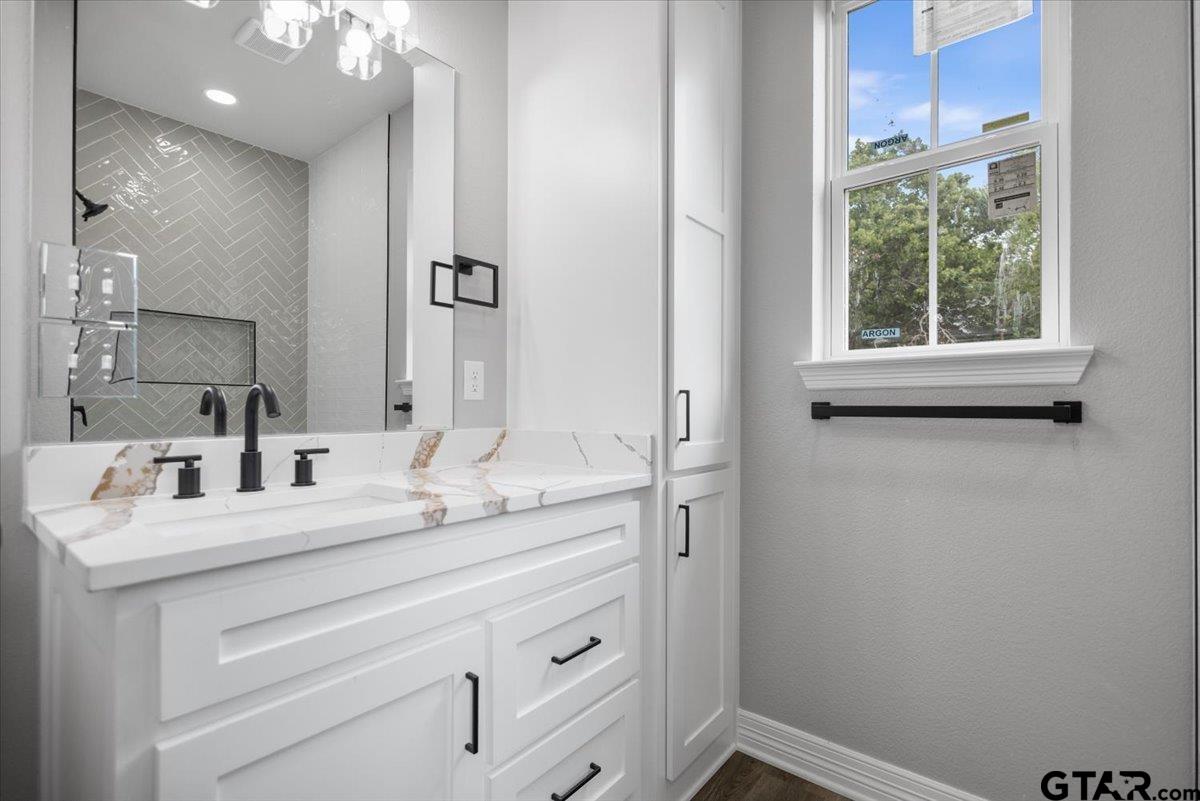 19462 Cedarpark Place Lindale, TX 75771 - Photo 32 of 48 a bathroom with a sink and a mirror