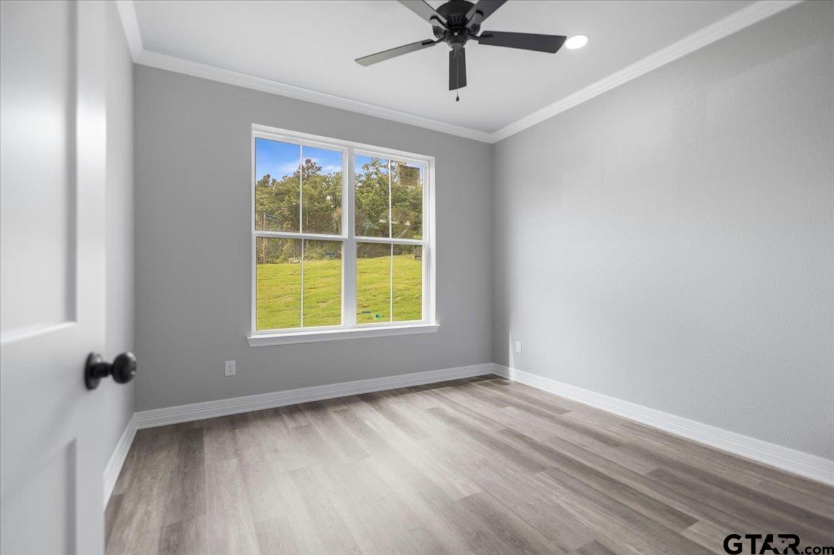 19462 Cedarpark Place Lindale, TX 75771 - Photo 41 of 48 wooden floor in an empty room with a window