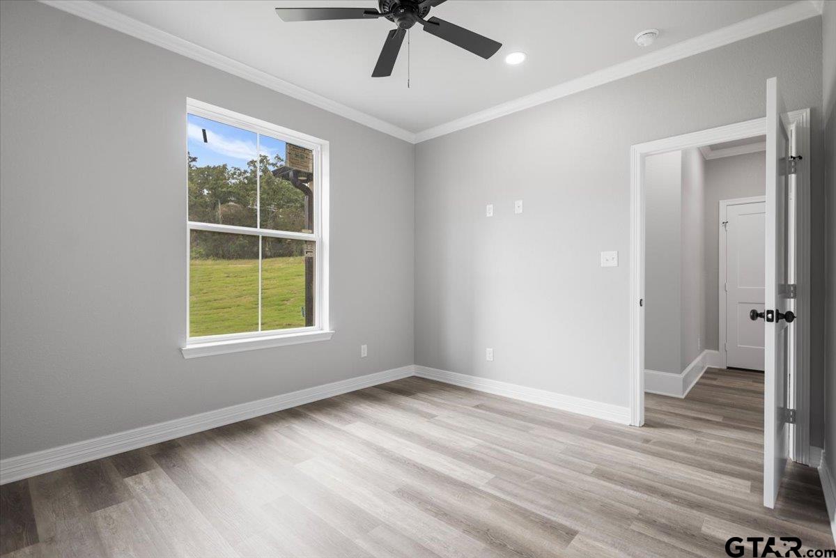 19462 Cedarpark Place Lindale, TX 75771 - Photo 44 of 48 a view of an empty room with wooden floor and a window