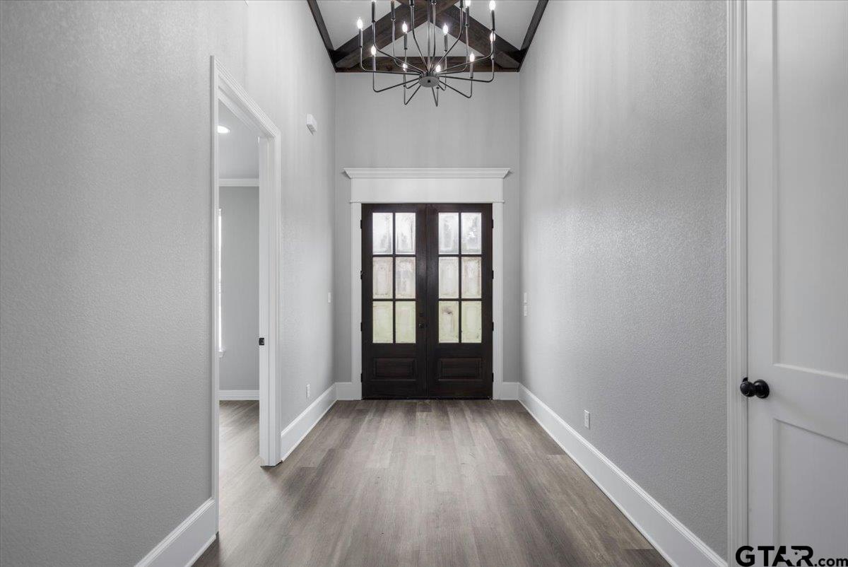 19462 Cedarpark Place Lindale, TX 75771 - Photo 5 of 48 wooden floor in an empty room with a window