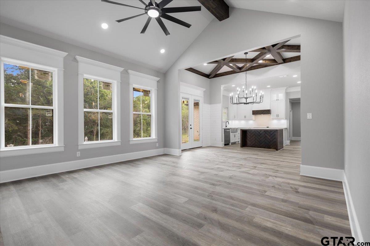 19462 Cedarpark Place Lindale, TX 75771 - Photo 8 of 48 an empty room with wooden floor and windows