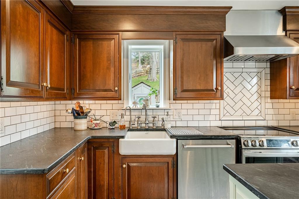 701 Oakbourne Road West Chester, PA 19382 - Photo 19 of 50 a kitchen with stainless steel appliances granite countertop a sink and a stove