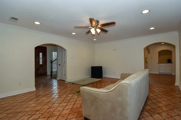 a living room with furniture and a rug