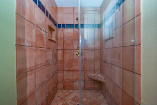 a bathroom with a tub sink and shower