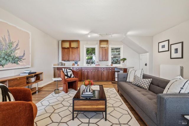 a bedroom with bed and a couch