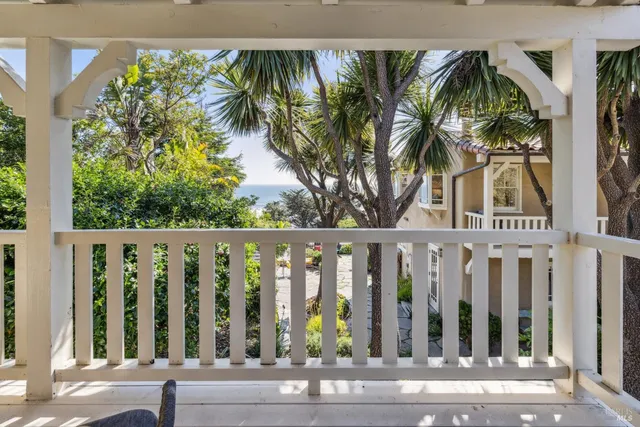 a view of a chairs and table in a backyard