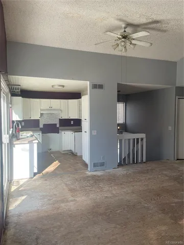 a view of a kitchen with a sink