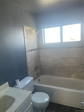 a bathroom with a sink toilet and bathtub