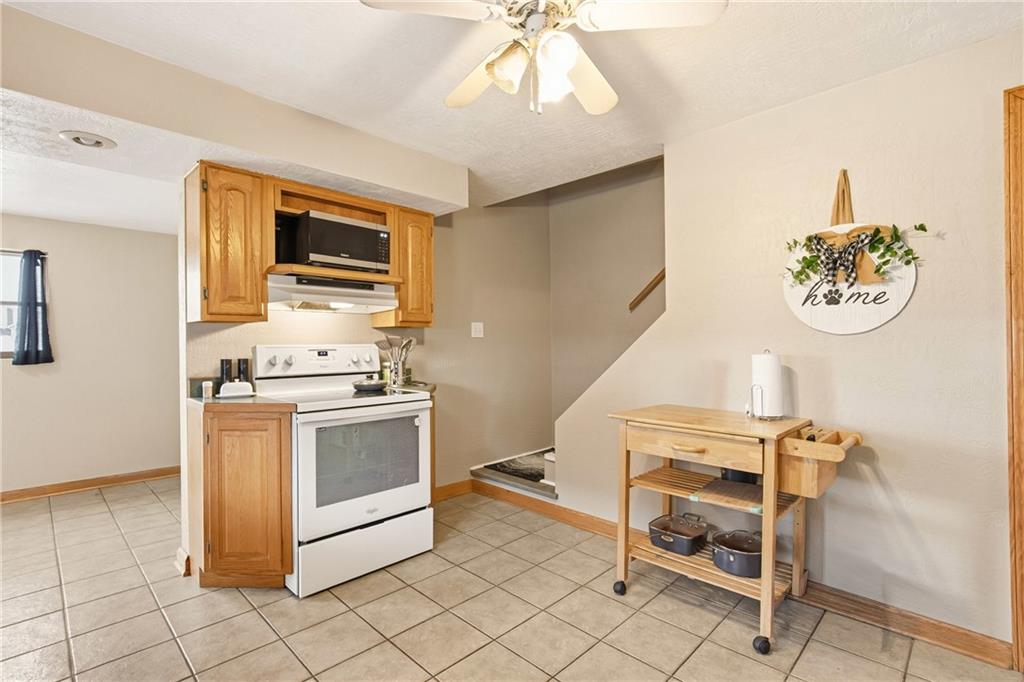 36 3rd Street Cairnbrook, PA 15924 - Photo 14 of 50 a kitchen with a stove and a microwave