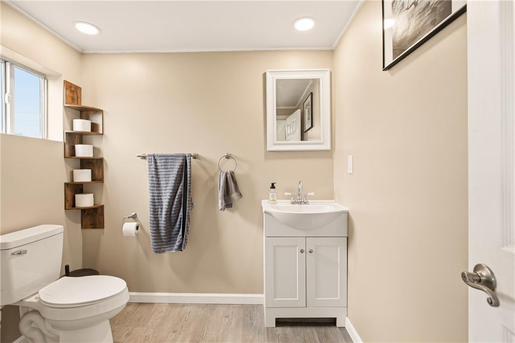 36 3rd Street Cairnbrook, PA 15924 - Photo 16 of 50 a bathroom with a toilet sink and a mirror