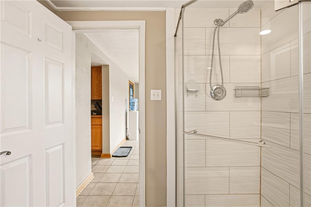 36 3rd Street Cairnbrook, PA 15924 - Photo 17 of 50 a bathroom with a shower and a glass door