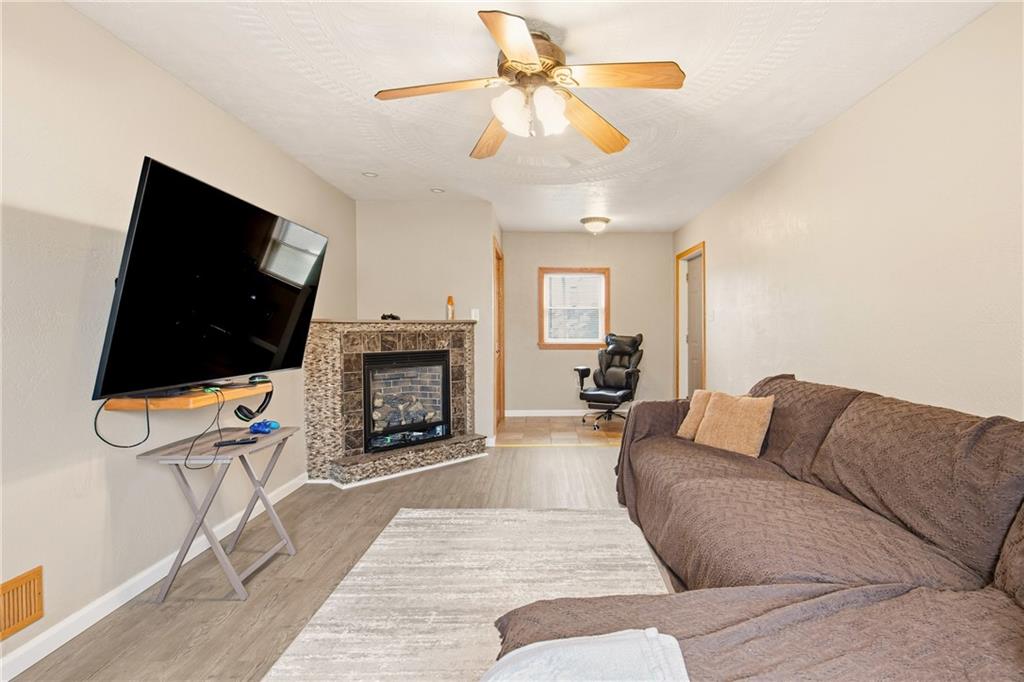 36 3rd Street Cairnbrook, PA 15924 - Photo 20 of 50 a living room with furniture a flat screen tv and a fireplace
