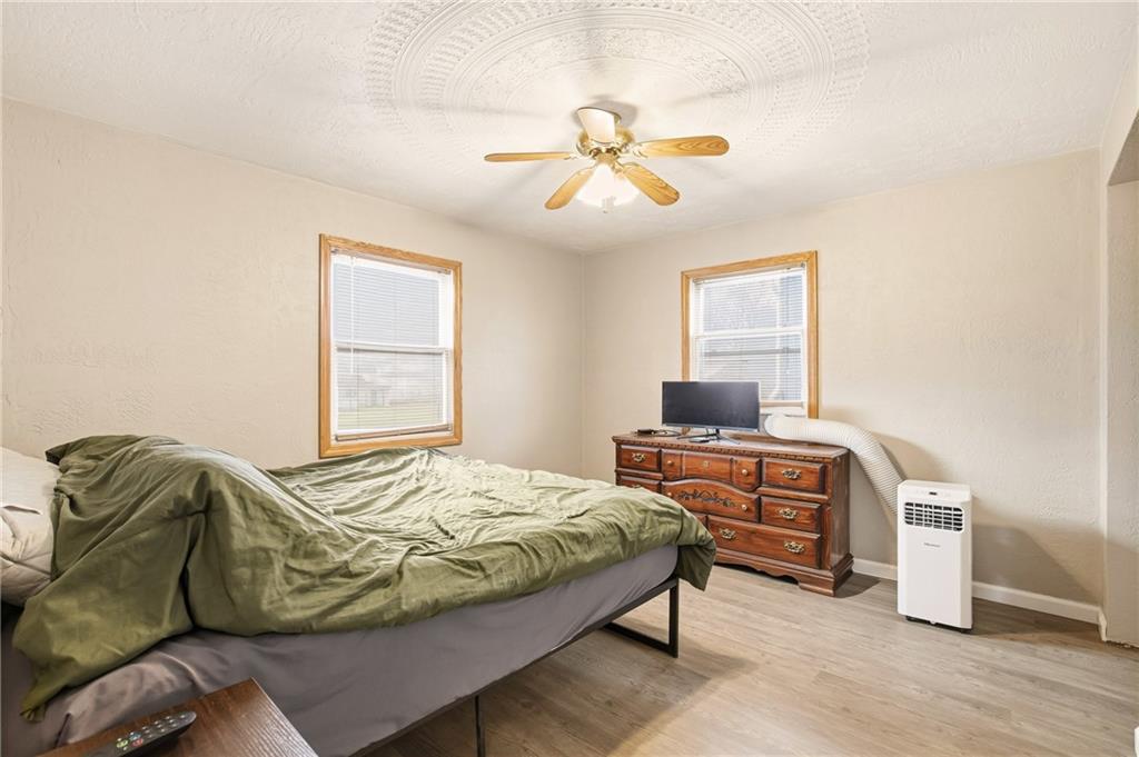 36 3rd Street Cairnbrook, PA 15924 - Photo 22 of 50 a bedroom with a bed and a chandelier