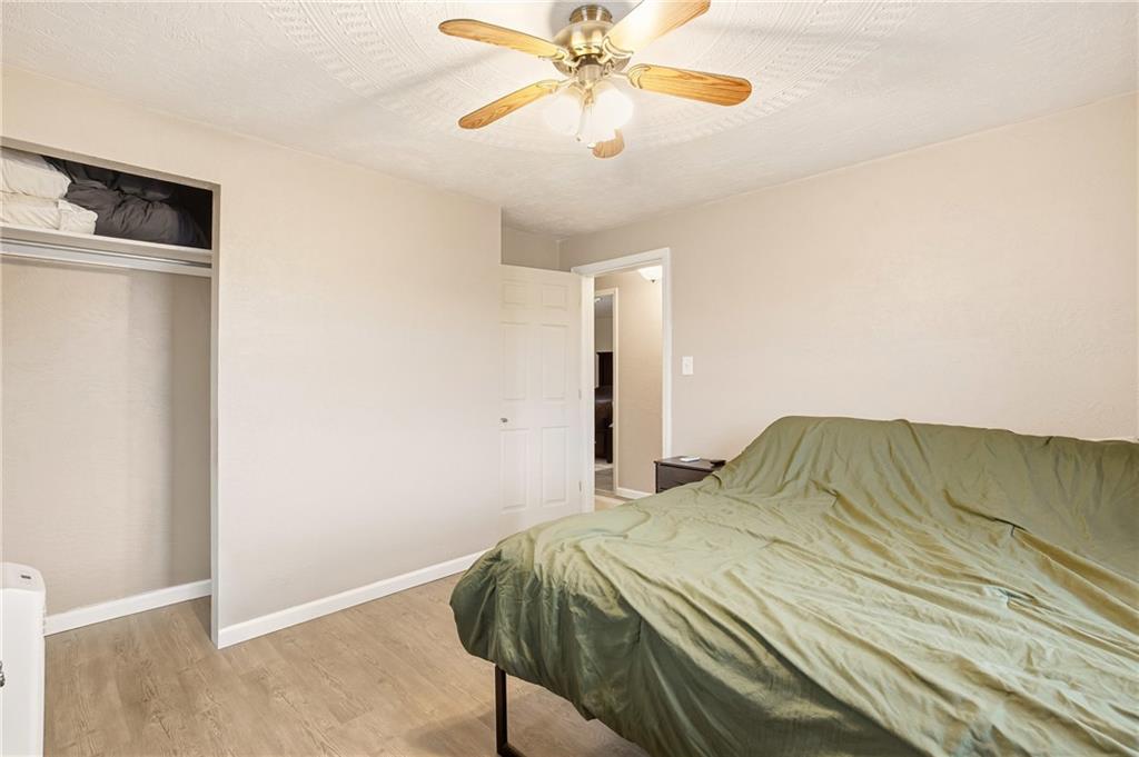 36 3rd Street Cairnbrook, PA 15924 - Photo 23 of 50 a bedroom with a bed and a chandelier