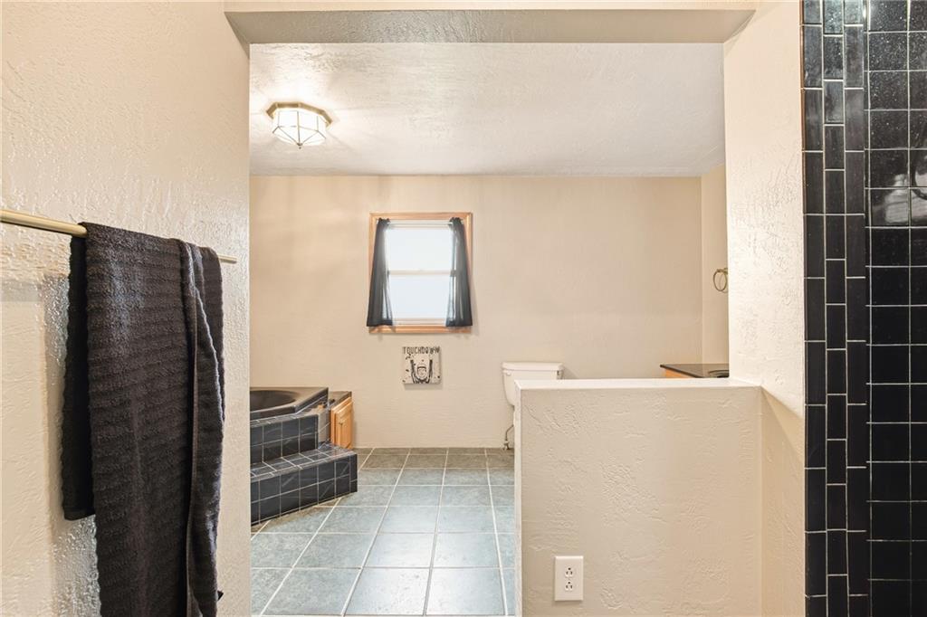 36 3rd Street Cairnbrook, PA 15924 - Photo 30 of 50 a bathroom with a shower and a sink
