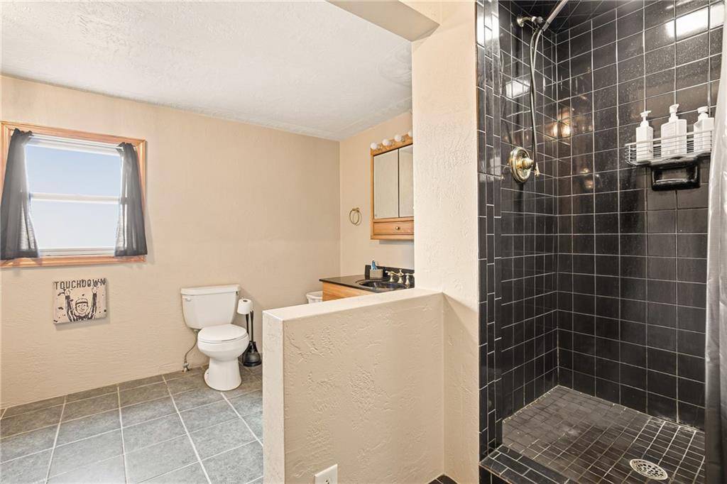 36 3rd Street Cairnbrook, PA 15924 - Photo 31 of 50 a bathroom with a toilet sink and shower