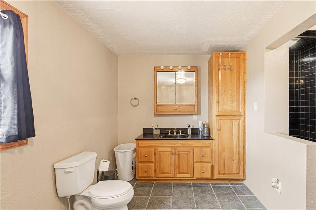 36 3rd Street Cairnbrook, PA 15924 - Photo 33 of 50 a bathroom with a toilet a sink and a window