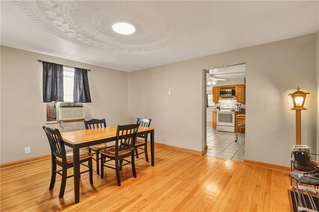 36 3rd Street Cairnbrook, PA 15924 - Photo 9 of 50 a view of a dining room with furniture and wooden floor